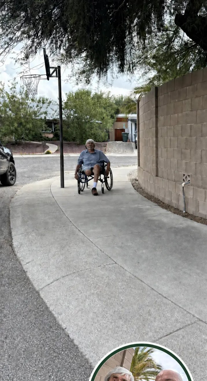 The same curb and walkway cleared and swept, with the homeowner able to use it in his wheelchair